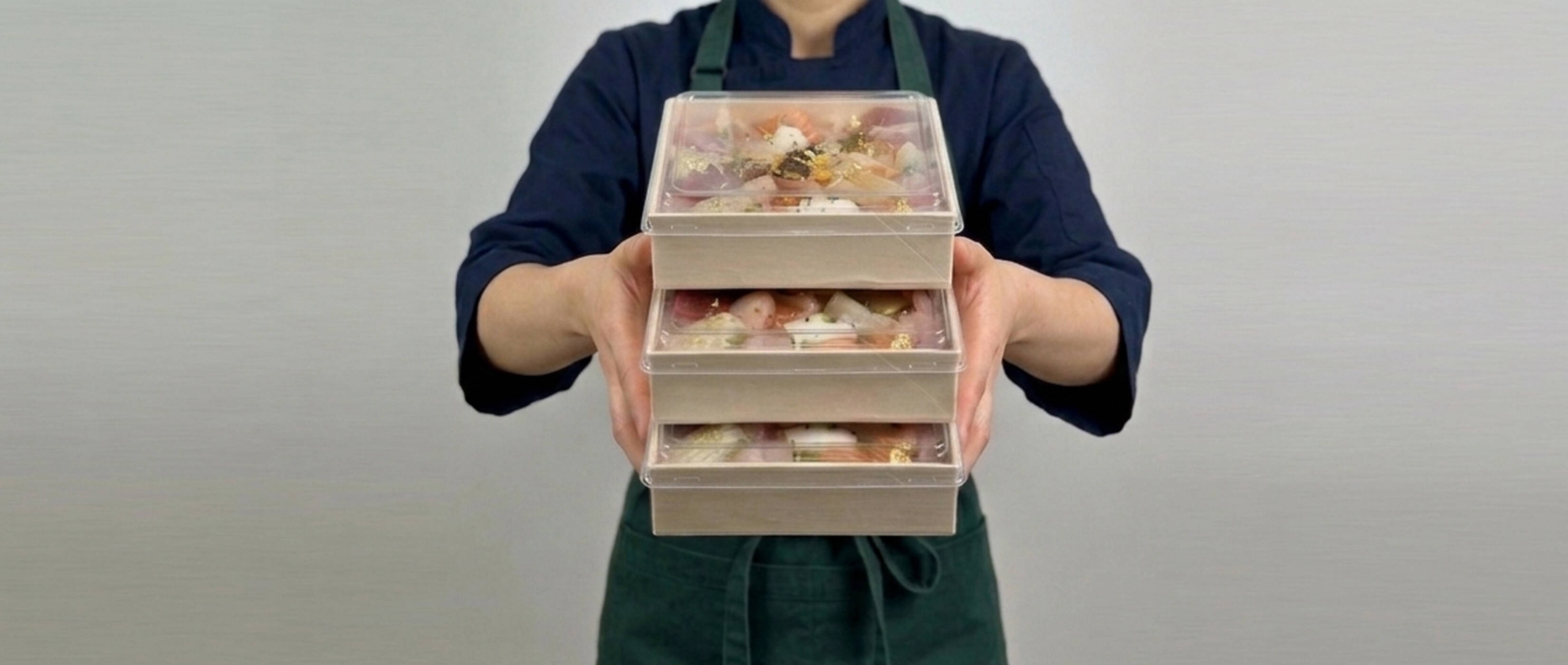 Kibako wooden presentation boxes held in a precise stack